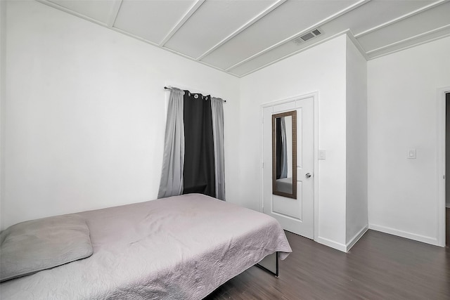 bedroom featuring dark wood-type flooring