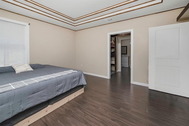 bedroom with dark hardwood / wood-style flooring