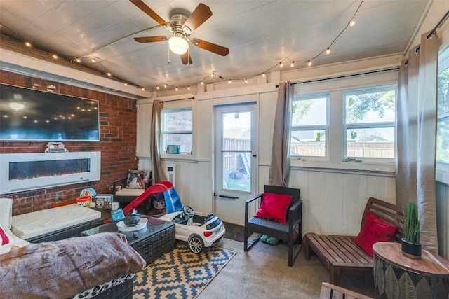 living room with ceiling fan and lofted ceiling