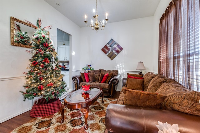 living room featuring a chandelier and wood-type flooring