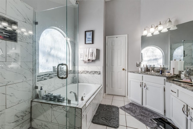 bathroom with vanity, tile patterned floors, and separate shower and tub