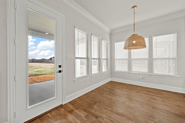 interior space with wood-type flooring and ornamental molding