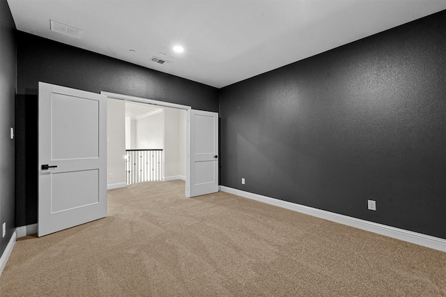 unfurnished bedroom with light carpet