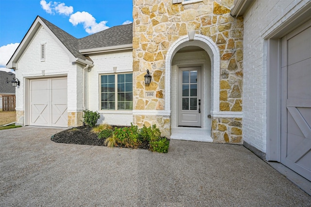 view of exterior entry featuring a garage