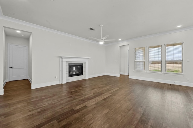 unfurnished living room featuring dark hardwood / wood-style floors, ceiling fan, and crown molding