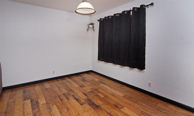 unfurnished room featuring hardwood / wood-style floors