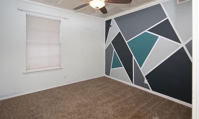 spare room featuring carpet and ceiling fan