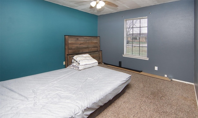 bedroom featuring ceiling fan and carpet flooring