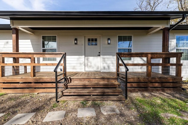 view of exterior entry featuring a porch