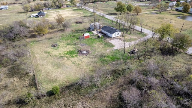 bird's eye view featuring a rural view and a water view