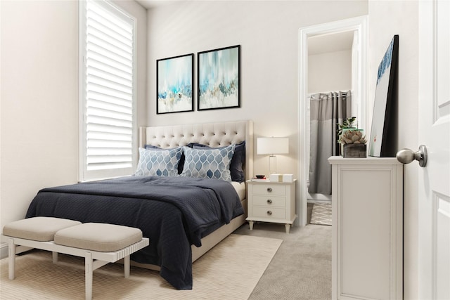 bedroom featuring multiple windows and light carpet