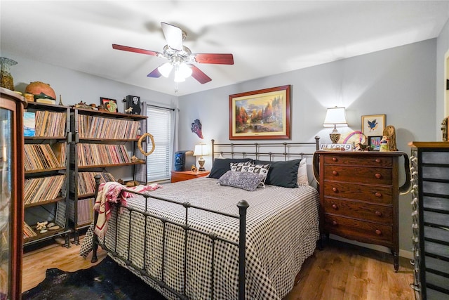 bedroom featuring hardwood / wood-style flooring and ceiling fan