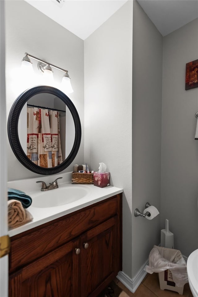 bathroom with tile patterned flooring and vanity