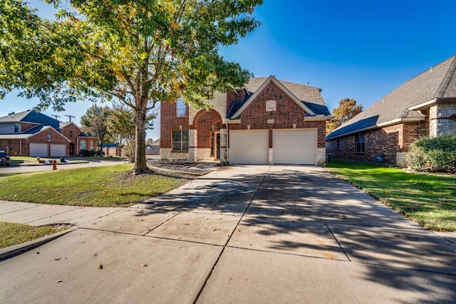 front facade featuring a garage and a front yard