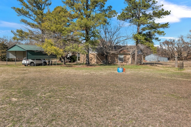 view of yard with a carport