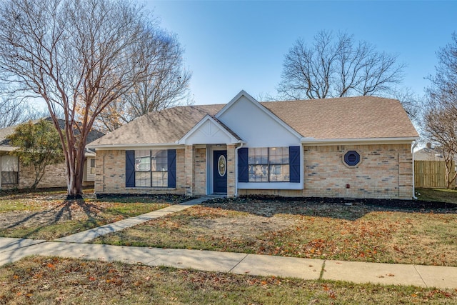 ranch-style home featuring a front yard