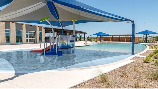 view of swimming pool featuring a patio area