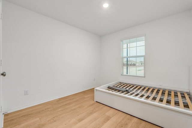 unfurnished room with light hardwood / wood-style flooring