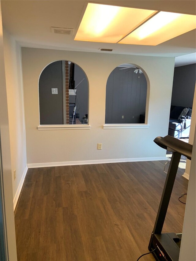 spare room with dark hardwood / wood-style flooring