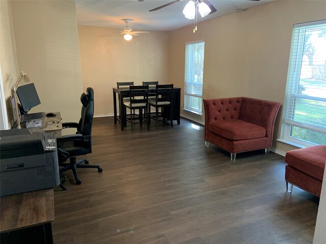 office with plenty of natural light, ceiling fan, and dark wood-type flooring