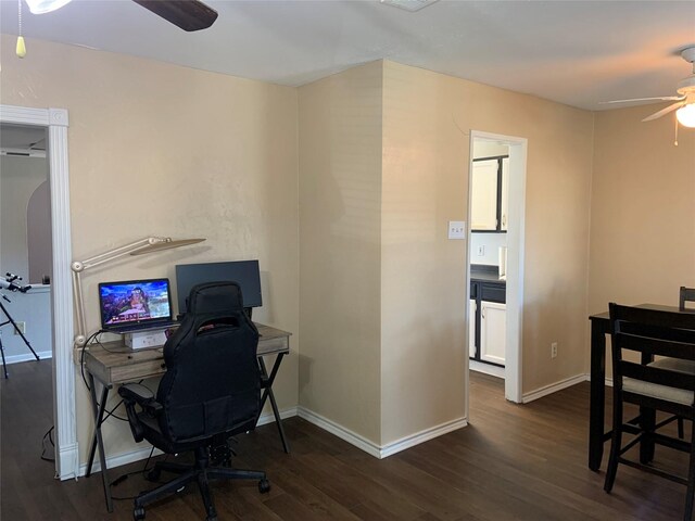 office space featuring ceiling fan and dark hardwood / wood-style floors