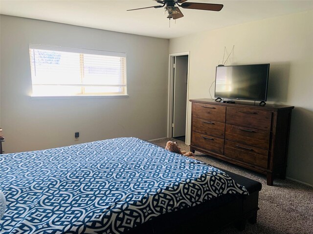 bedroom with ceiling fan and carpet floors