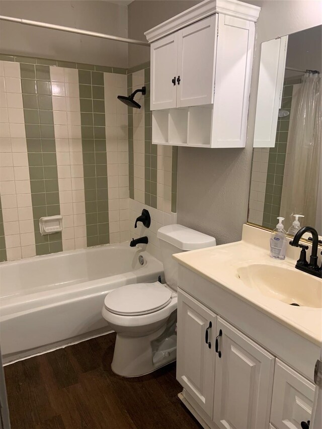 full bathroom with toilet, vanity, shower / bath combination with curtain, and hardwood / wood-style flooring