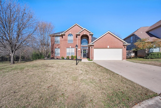 view of front property with a garage and a front yard