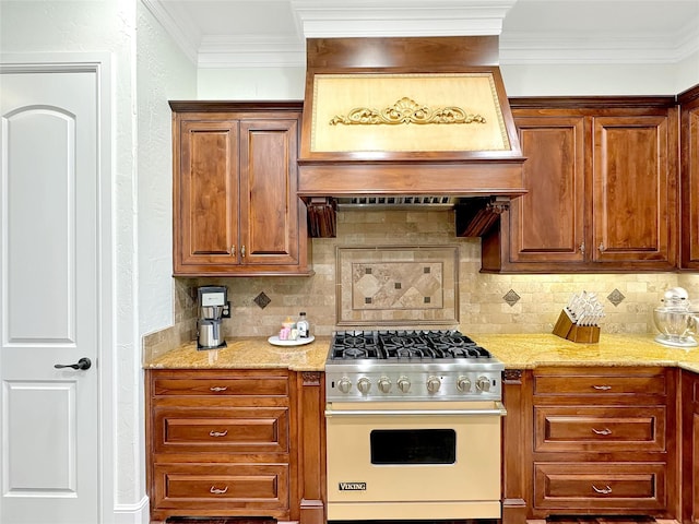 6565 Rockridge Trl, Aubrey, TX 76227 - kitchen featuring premium range, tasteful backsplash, light stone countertops, crown molding, and brown cabinetry