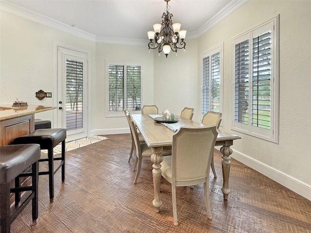 6565 Rockridge Trl, Aubrey, TX 76227 - dining area with a chandelier, ornamental molding, baseboards, and dark wood-style floors