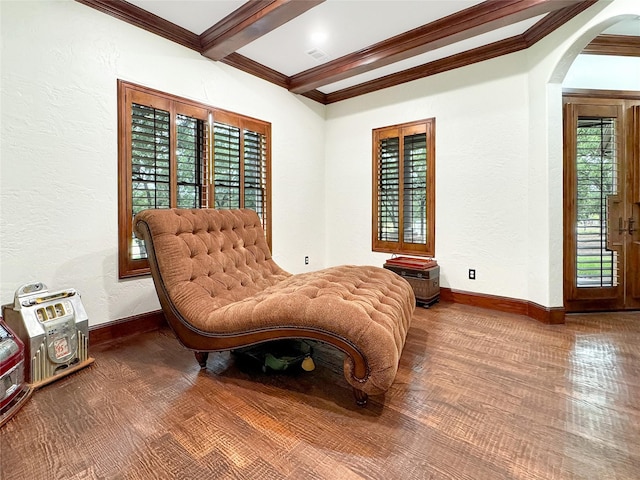 sitting room with hardwood / wood-style floors, beam ceiling, and crown molding