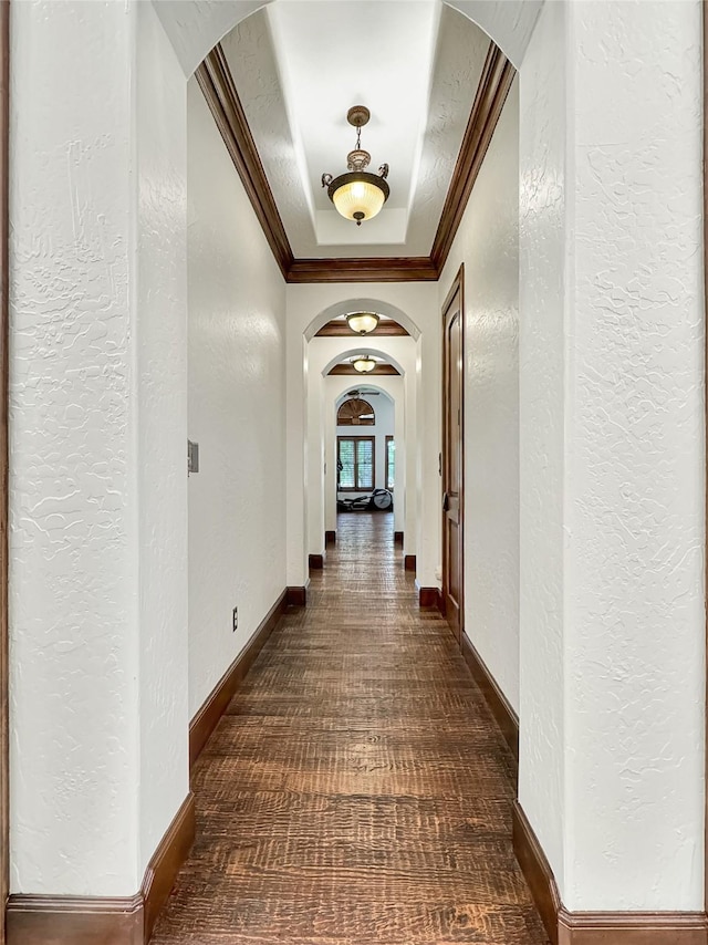 hallway featuring ornamental molding