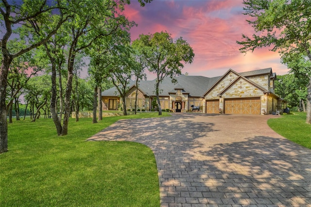 6565 Rockridge Trl, Aubrey, TX 76227 - view of front of property with stone siding, a garage, decorative driveway, and a front yard