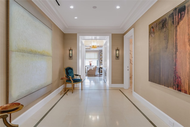 corridor featuring an inviting chandelier, crown molding, and light tile patterned floors