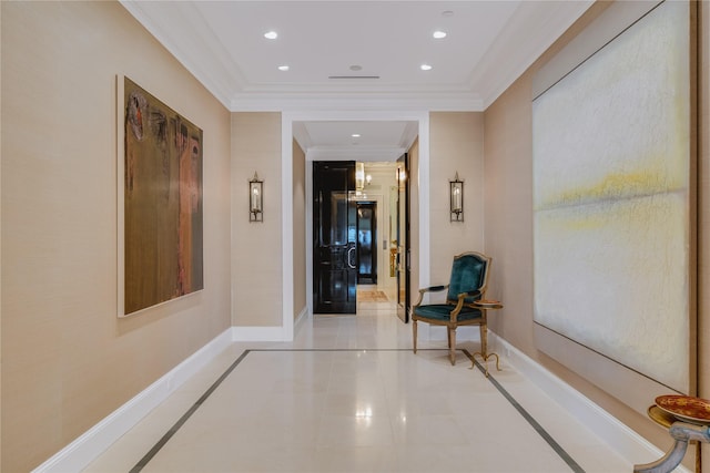 hallway featuring ornamental molding and light tile patterned floors