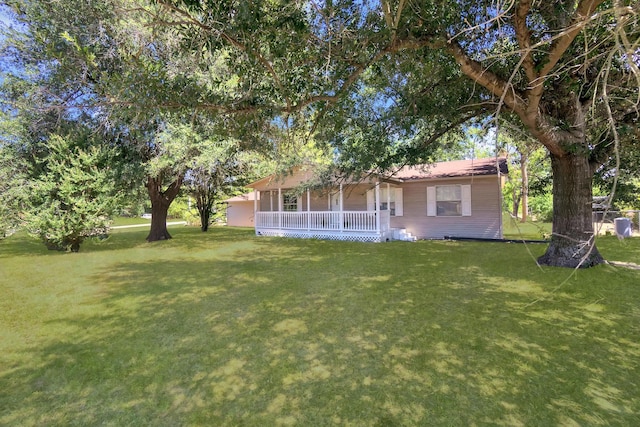 view of yard featuring covered porch