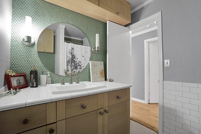 bathroom with hardwood / wood-style flooring and vanity