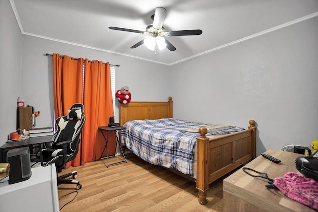 bedroom featuring light hardwood / wood-style flooring, ornamental molding, and ceiling fan