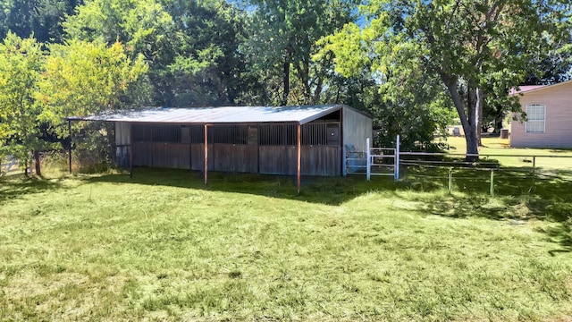 view of outbuilding featuring a yard