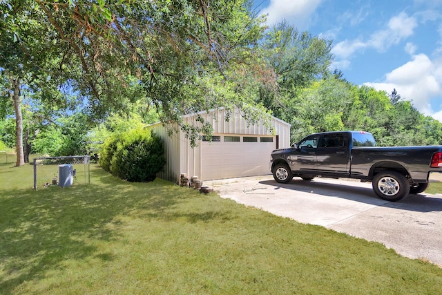 view of yard with an outbuilding and a garage