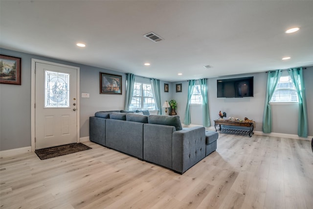 living room with light hardwood / wood-style floors