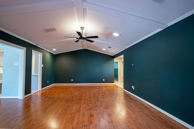 spare room featuring ceiling fan, wood-type flooring, lofted ceiling, and crown molding