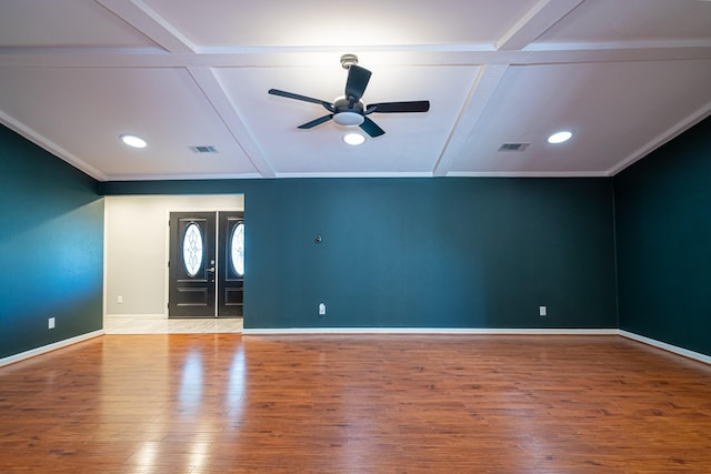 entrance foyer with beam ceiling, hardwood / wood-style flooring, ceiling fan, and coffered ceiling