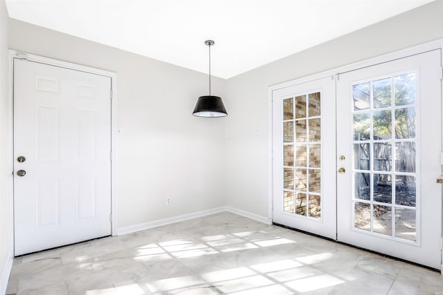 unfurnished dining area with french doors