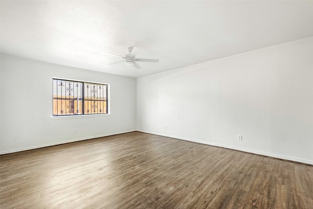 empty room featuring hardwood / wood-style floors, ceiling fan, and crown molding