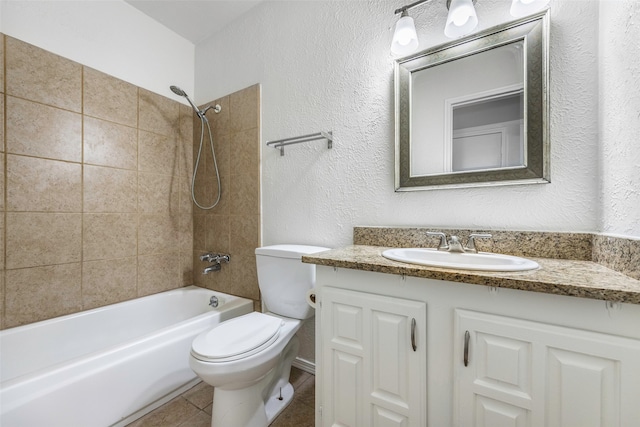 full bathroom featuring vanity, toilet, and tiled shower / bath