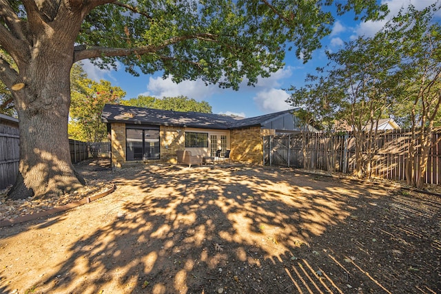 rear view of house featuring an outdoor living space