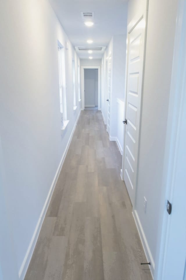 hallway featuring hardwood / wood-style flooring