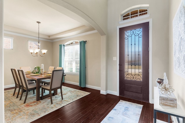 10014 Edgeway Cir, Rowlett, TX 75089 - foyer featuring dark wood-style flooring, arched walkways, a chandelier, and baseboards