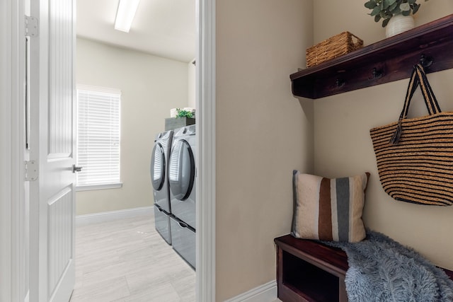 10014 Edgeway Cir, Rowlett, TX 75089 - washroom featuring washing machine and clothes dryer and baseboards